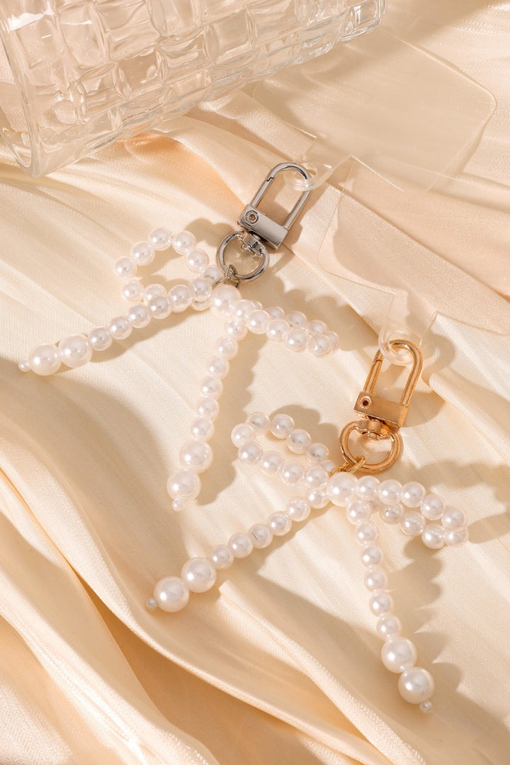 Telefoonhanger Pearl Bow Goud